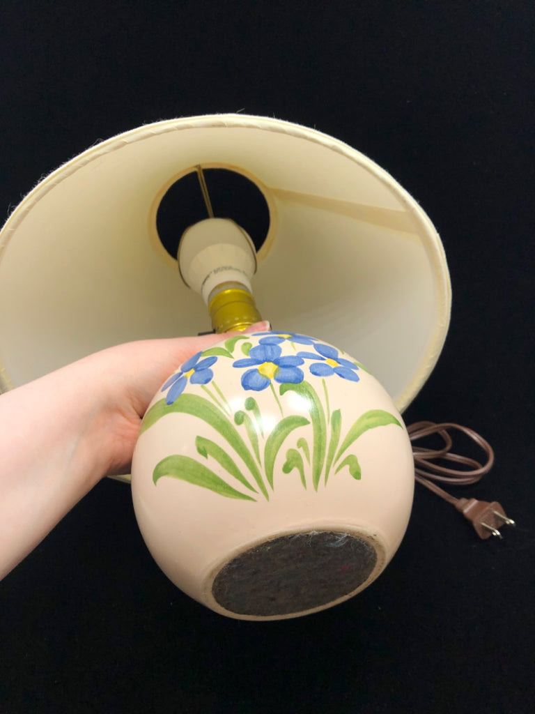 BLUE FLOWER PAINTED CREAM LAMP W/CREAM SHADE.