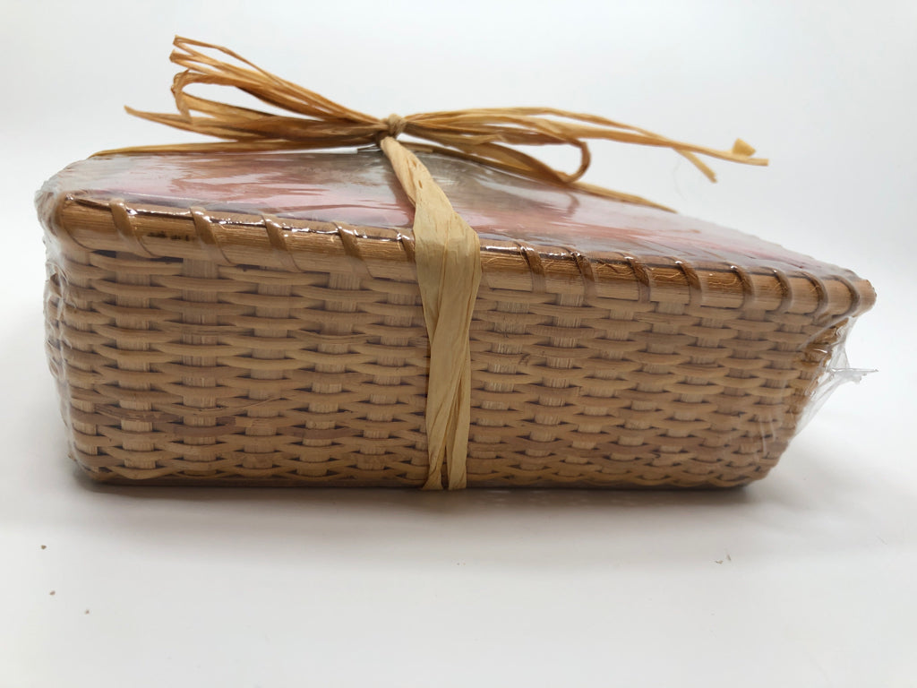 NIP RED SEASHELL PAPER NAPKINS IN BASKET.
