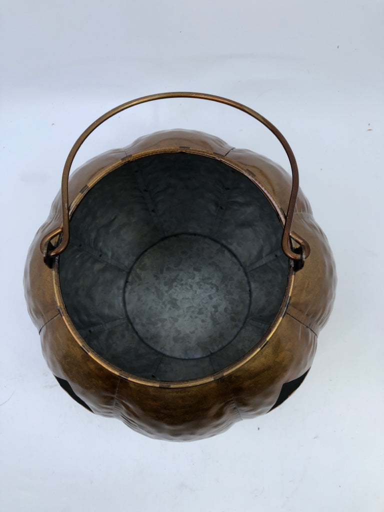 BRONZE JACK O LANTERN CANDLE HOLDER.