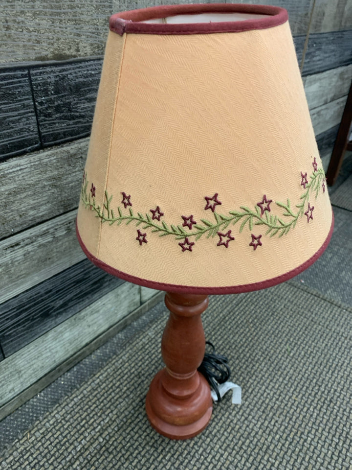 RED PRIMITIVE LAMP.