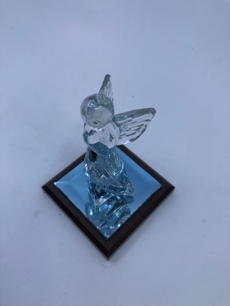 GLASS ANGEL ON WOOD BLOCK.