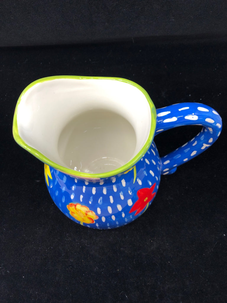 BLUE FLORAL PAINTED PITCHER.