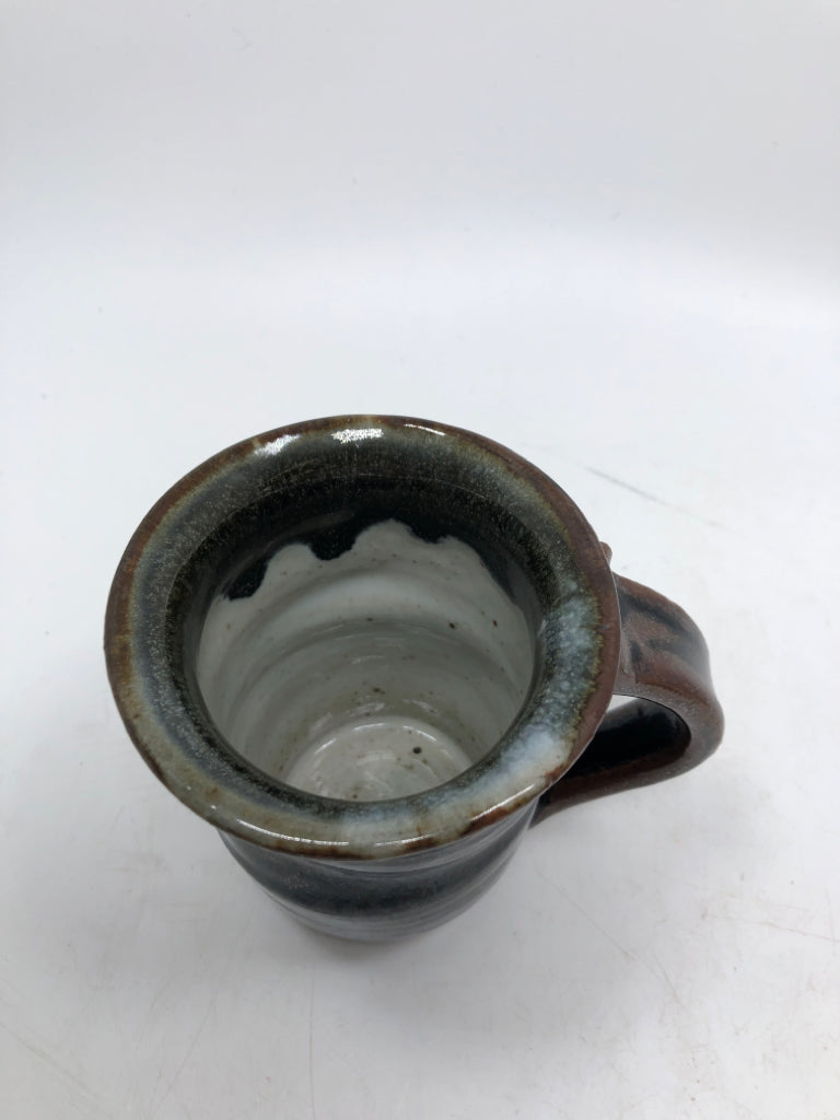 HAND SPUN BLACK GLAZED POTTERY MUG.