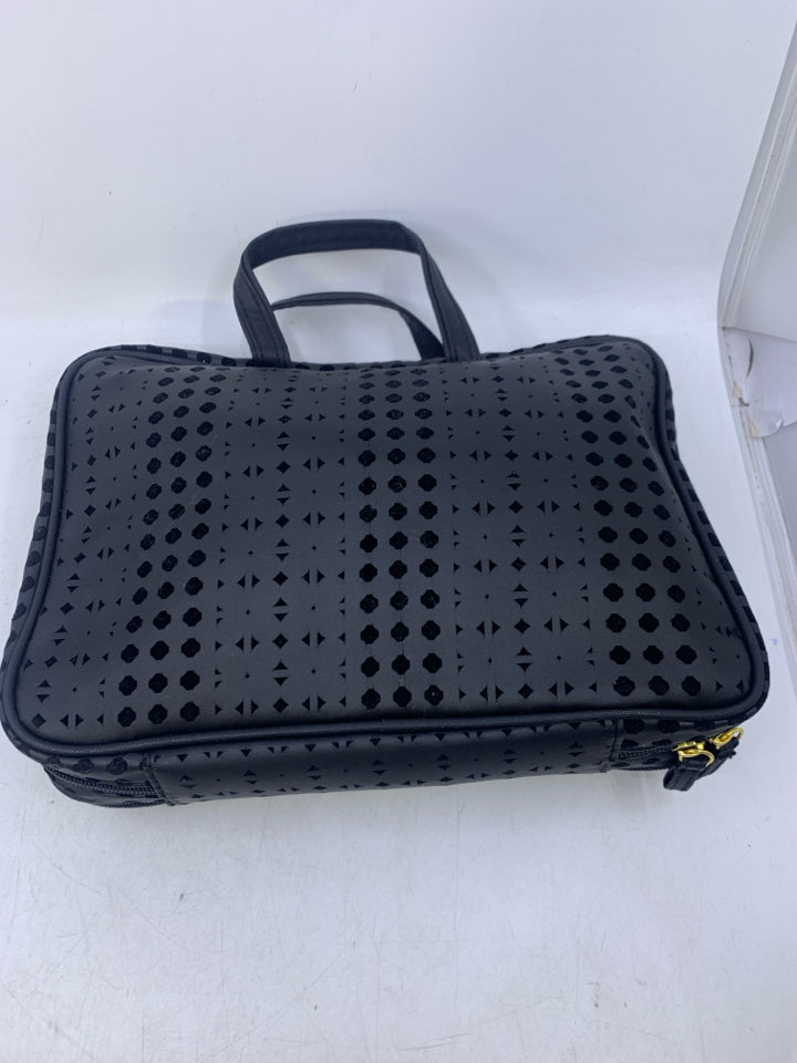 NEW BLACK W/ CUTOUTS COSMETIC TRAVEL BAG.