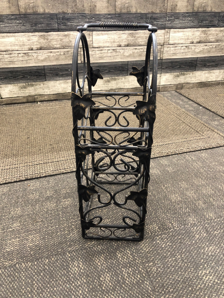 BLACK METAL ARCH SHAPED WINE RACK.