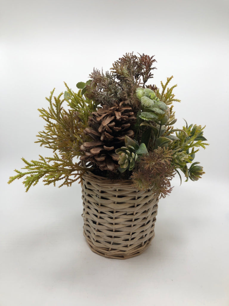 FAUX GREENERY ARRANGEMENT W/PINECONES IN WICKER VASE.