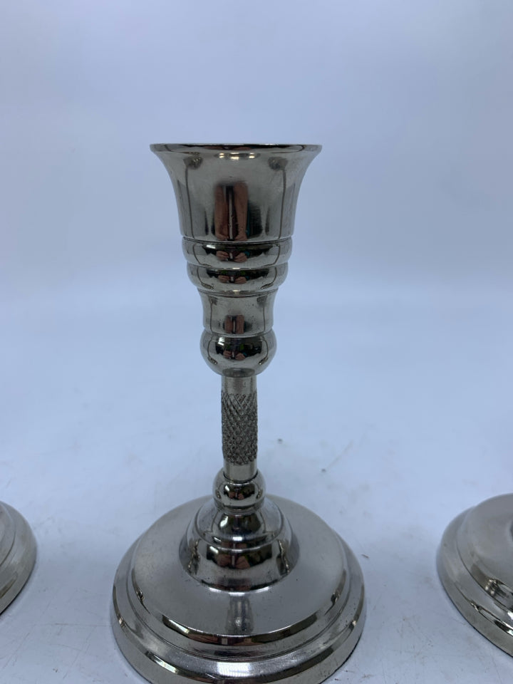 3 SILVER METAL TAPERED CANDLE HOLDERS.