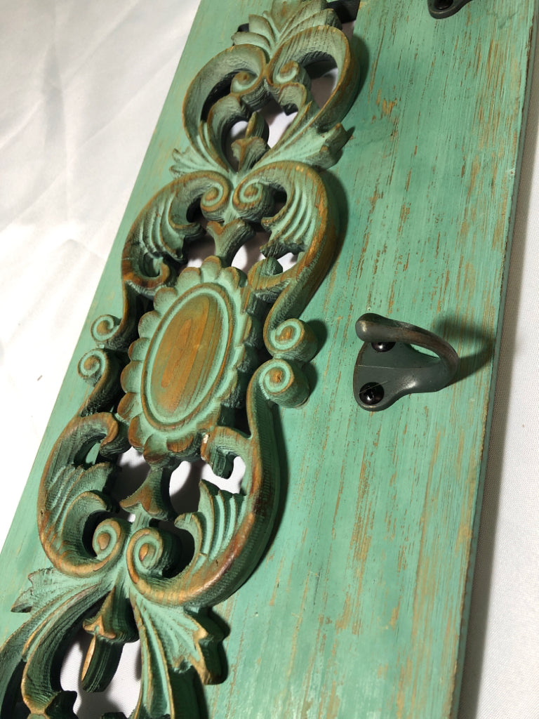 GREEN WASHED 3 HOOK WALL HANGING.