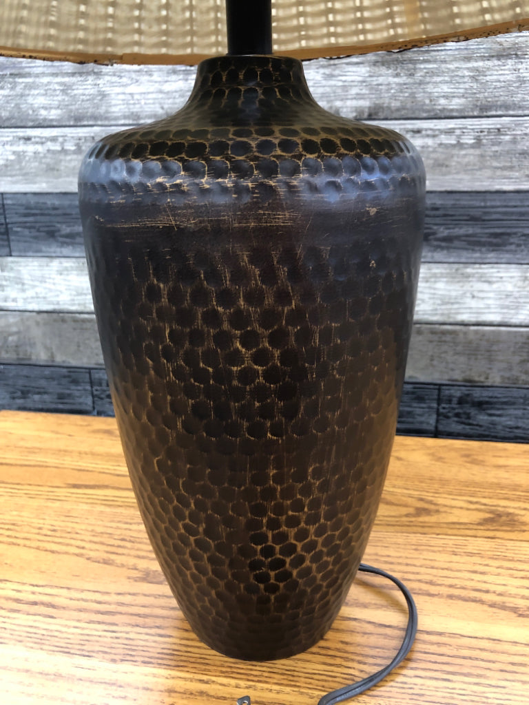 BRONZE BASE LAMP W/BROWN WICKER SHADE.
