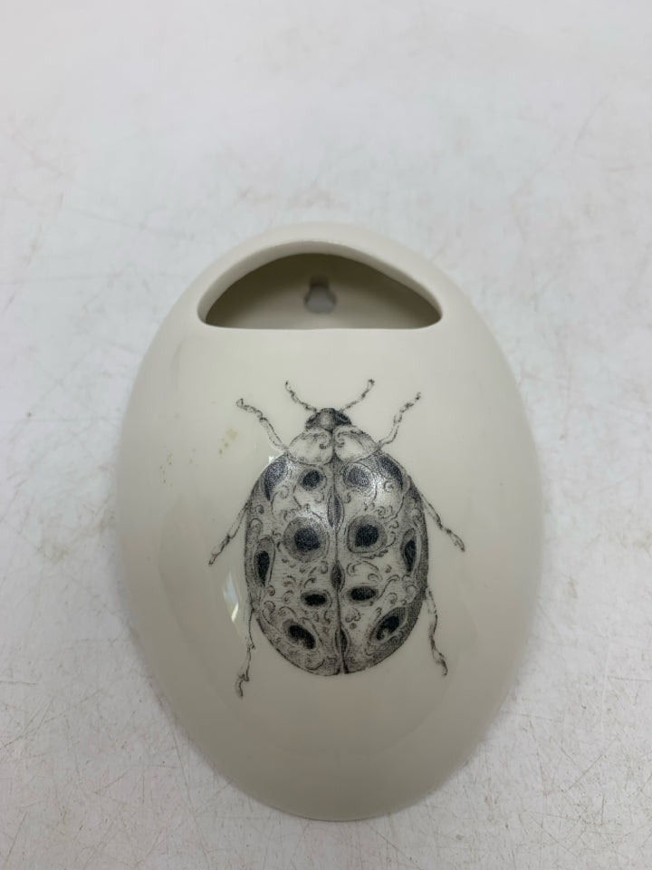 BEETLE WALL POCKET VASE.