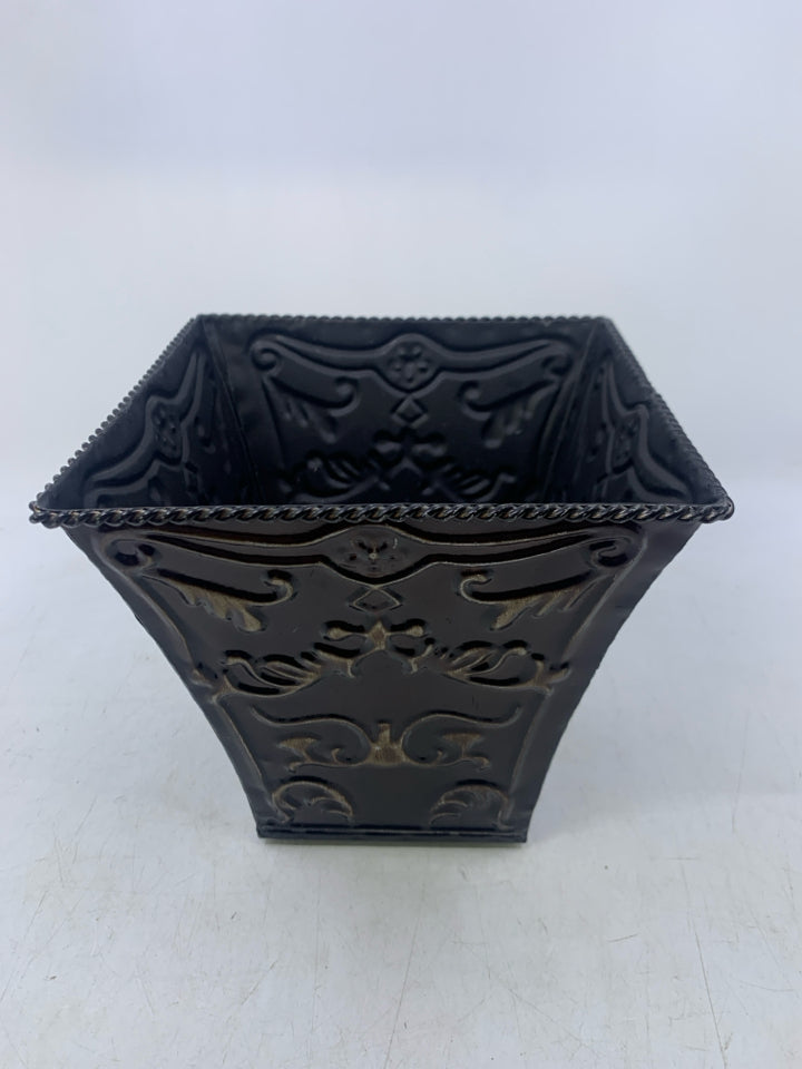 BROWN METAL PLANTER W/ EMBOSSED SCROLL.