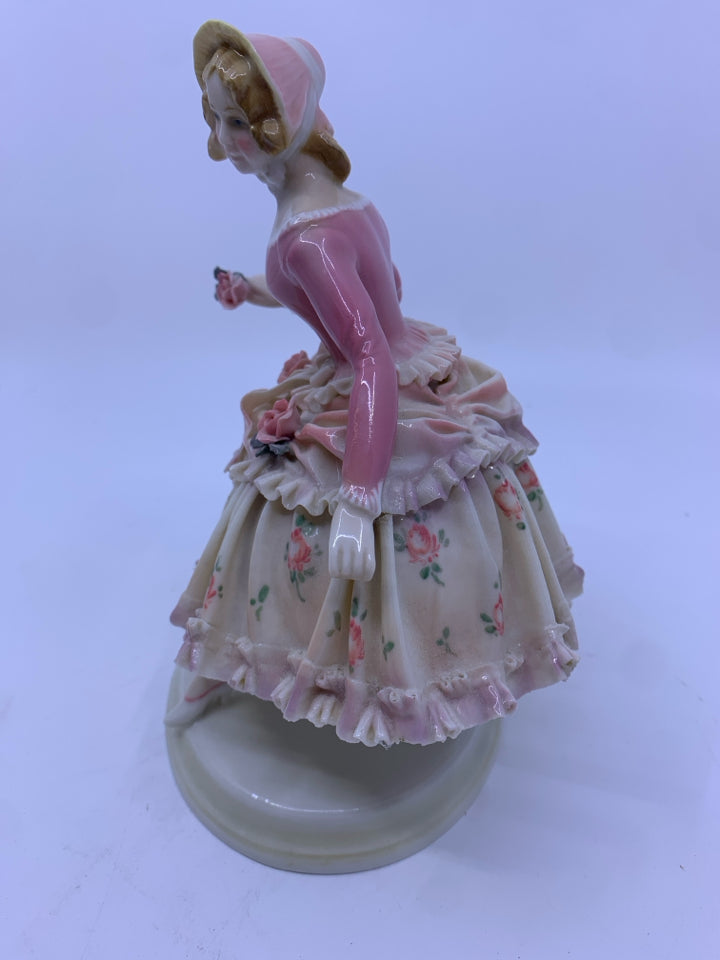 WOMAN IN LARGE PINK ROSE DRESS W/ BONNET ON STAND.