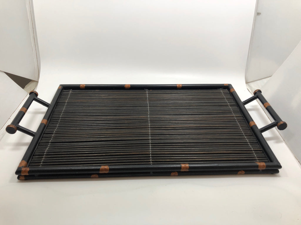 BLACK WICKER TRAY W/METAL RIM AND HANDLES.