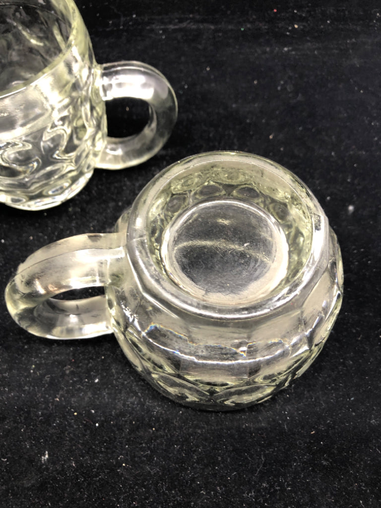 2 HEAVY THUMBPRINT GLASS MUGS.