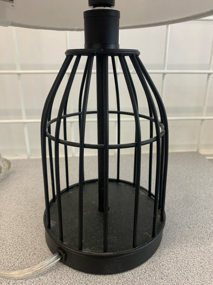 METAL CAGE LAMP WITH WHITE SHADE.