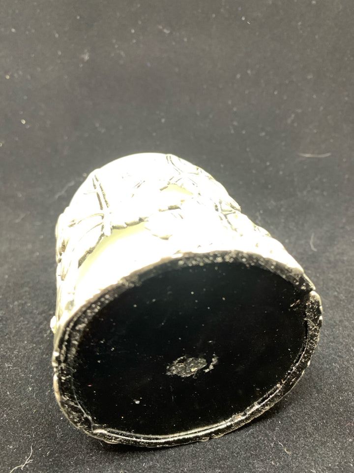 METAL LEAF COVERED CANDLE.