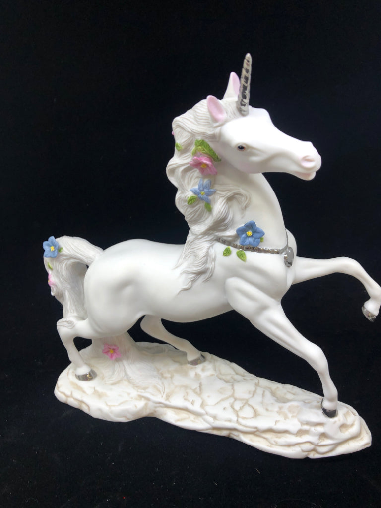 CERAMIC UNICORN W PINK AND BLUE FLOWERS.