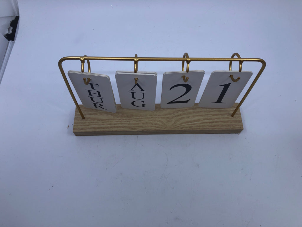GOLD/WOOD BASE FLIP PERPETUAL CALENDAR.