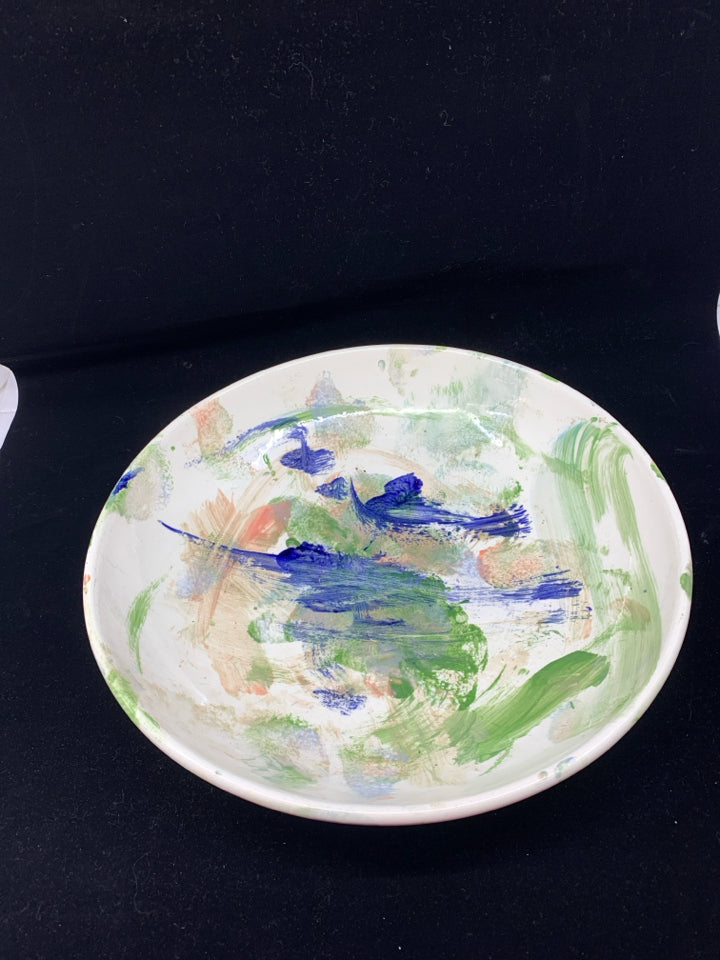 WHITE POTTERY BOWL W/ COLORFUL ABSTRACT DESIGN.