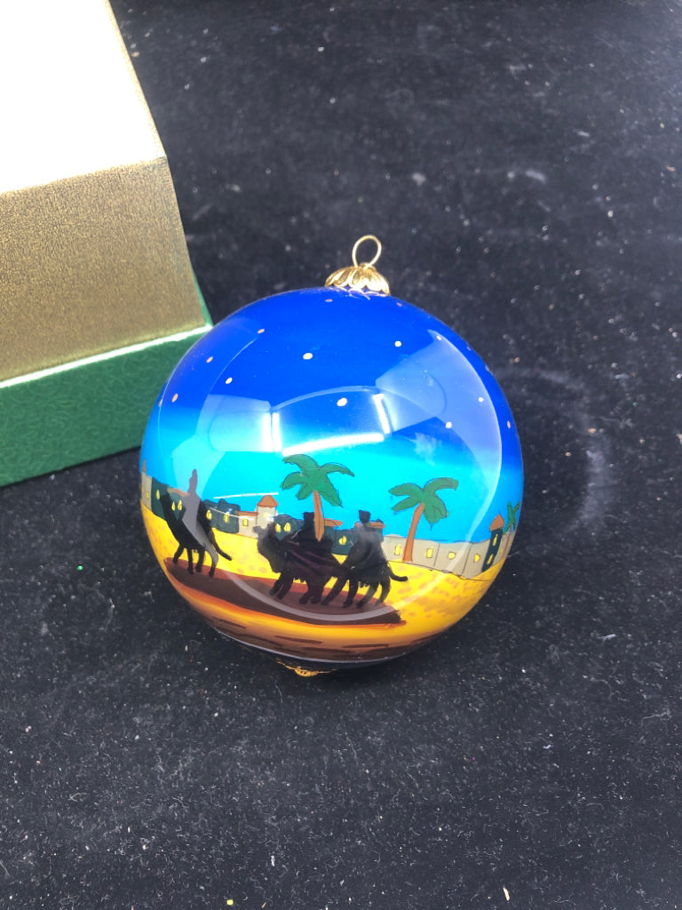 BLUE NATIVITY SCENE ORNAMENT IN GREEN BOX.