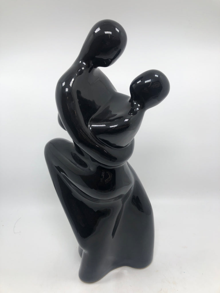 DANCING COUPLE BLACK-GLAZED FIGURINE.