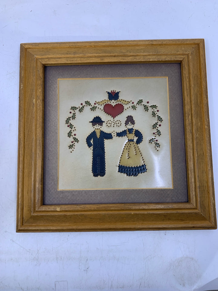 METAL PUNCHED AMISH COUPLE WALL ART.