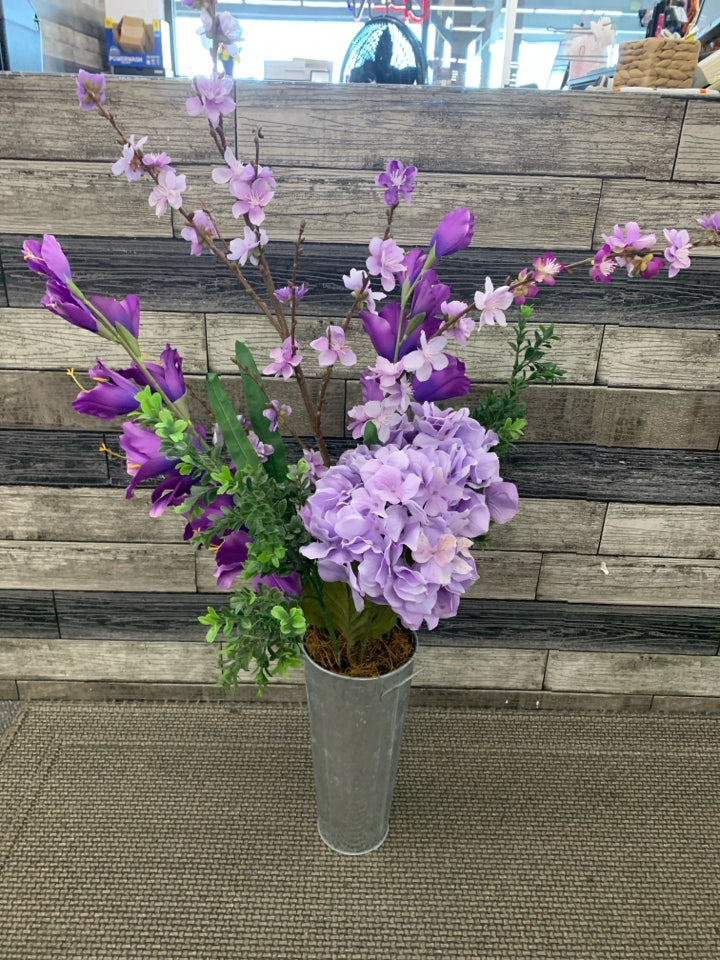FAUX PURPLE FLORAL IN METAL PLANTER.
