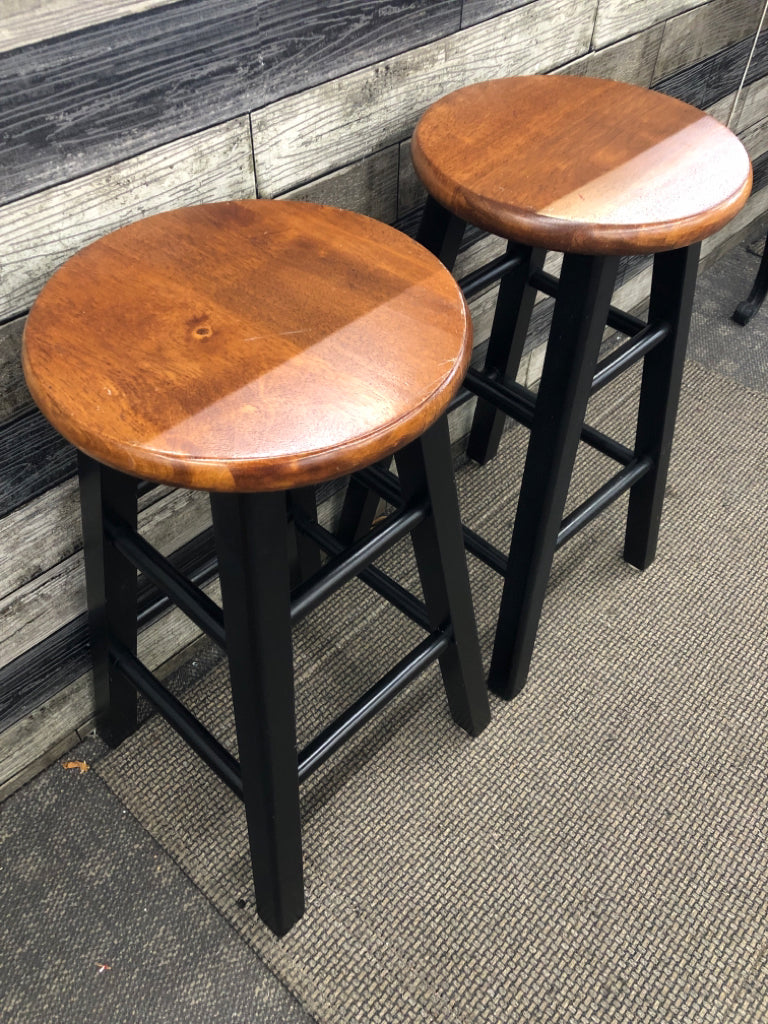 2 BLACK/DARK WOOD STOOLS.