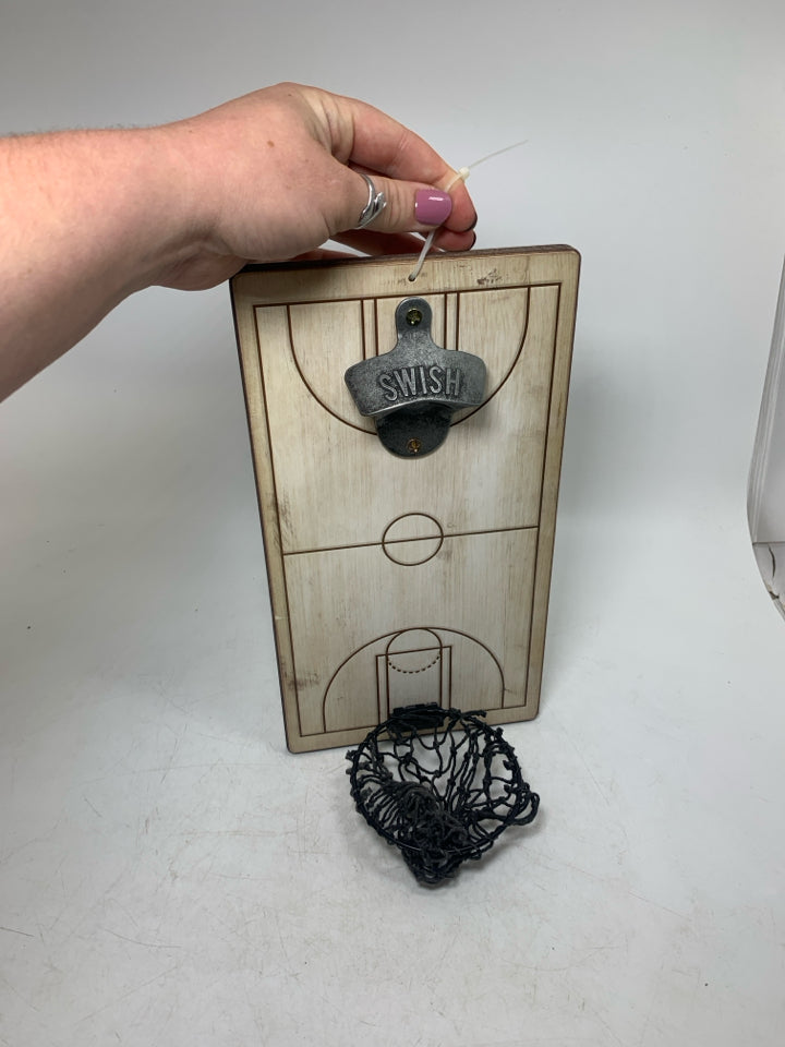 BOTTLE OPENER W/ CATCHING NET AT BOTTOM.