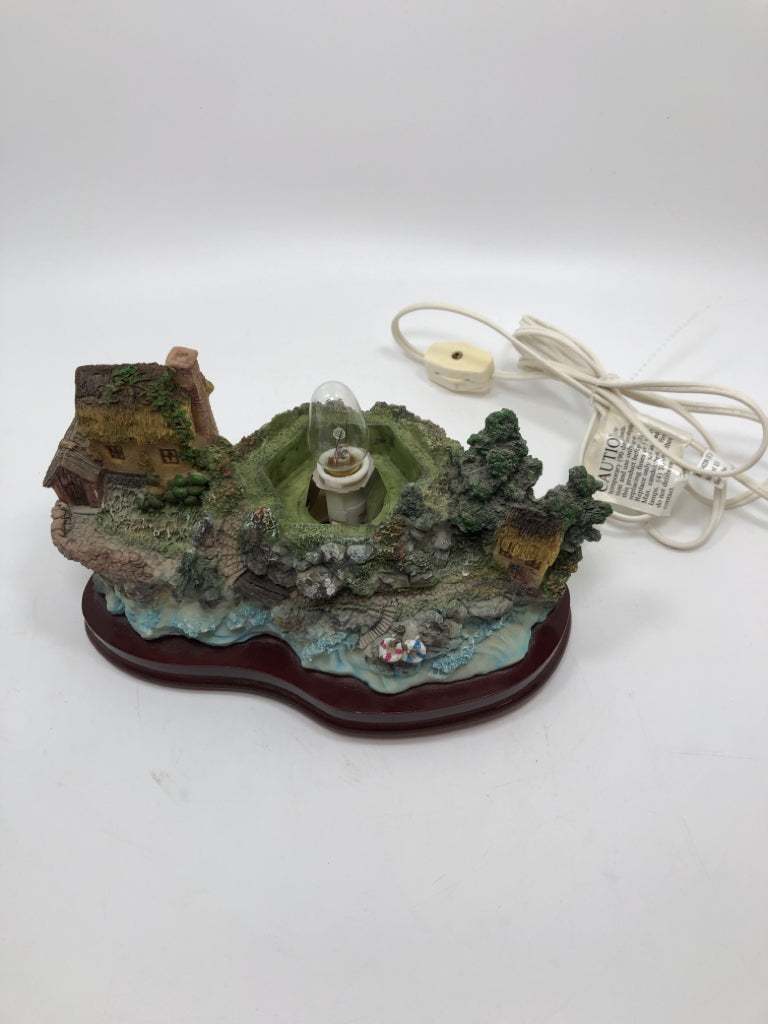 STAINED GLASS LIGHT HOUSE LAMP W/RESIN BASE.