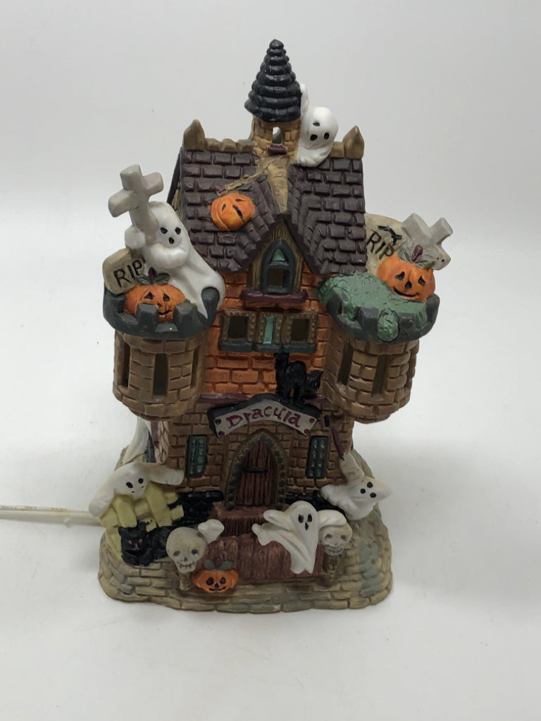 PORCELAIN ILLUMINATED "DRACULA" HAUNTED HOUSE.