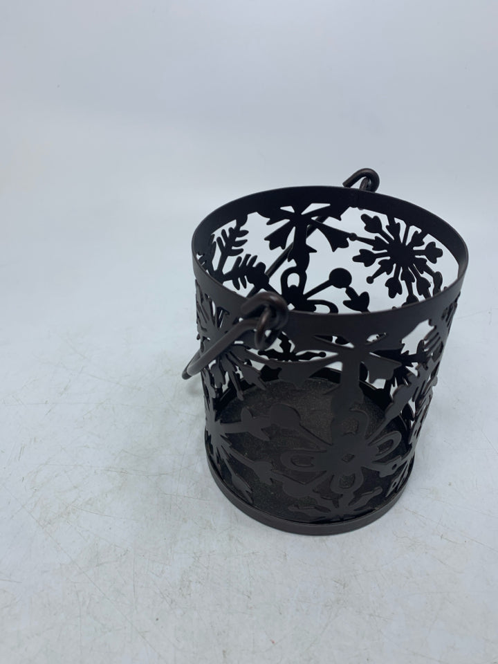 BROWN METAL SNOWFLAKE CANDLE HOLDER.