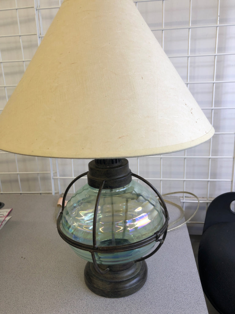 GREEN GLASS AND METAL BASE LAMP W/CREAM SHADE.