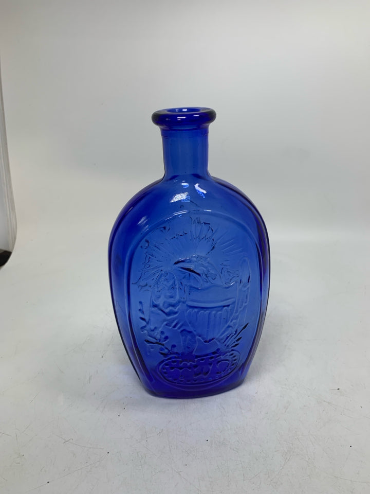 EMBOSSED SHIP BLUE GLASS BOTTLE EMPTY.