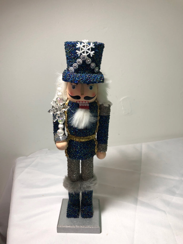 BLUE AND SILVER SNOWFLAKE NUT CRACKER.