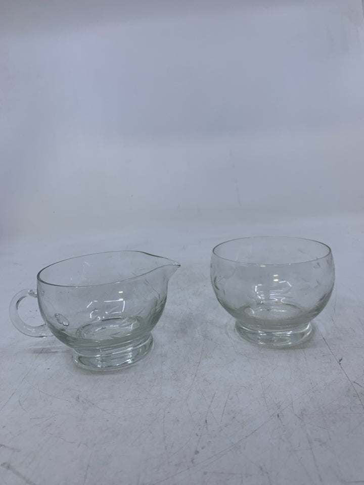 CLEAR GLASS W/ ETCHED FLOWERS.