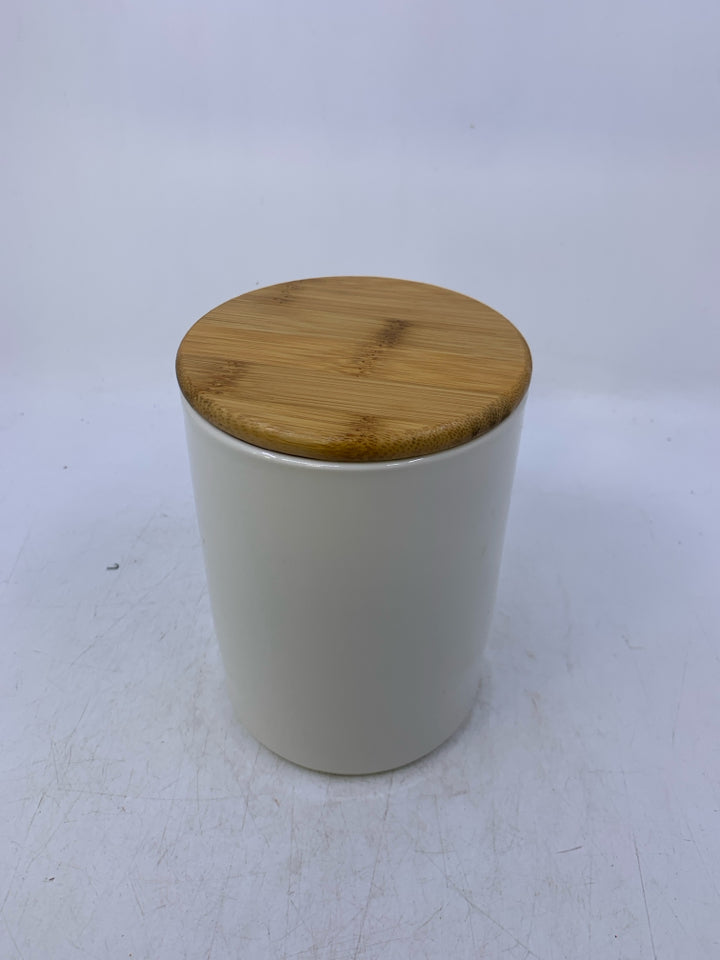 ILLUSTRATION OF BIRD W/ RED HAT OH JOY HANGING FROM TREE.