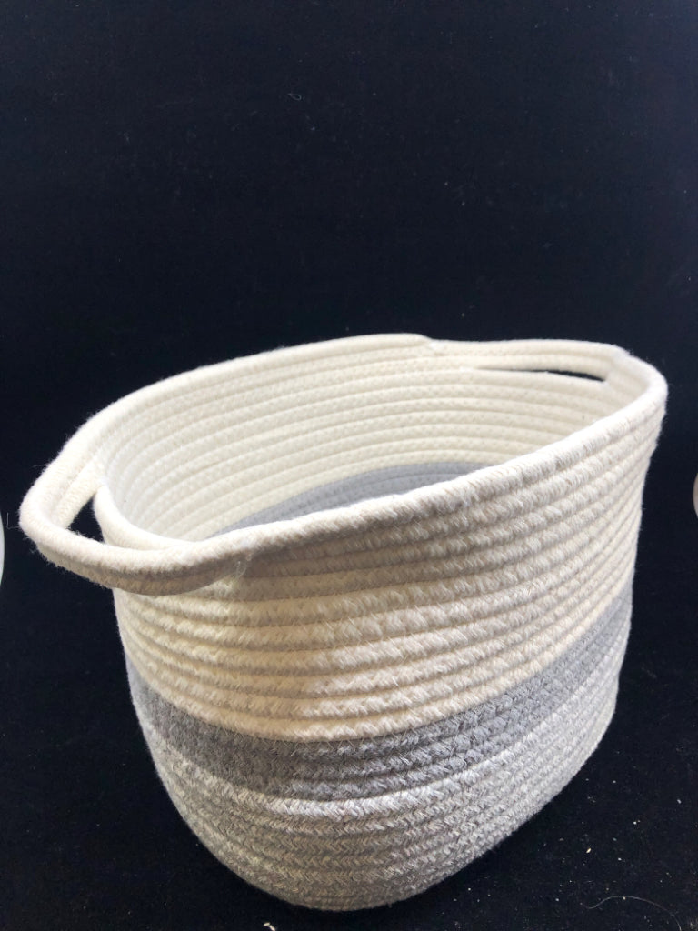GREY AND WHITE WOVEN BASKET W HANDLES.