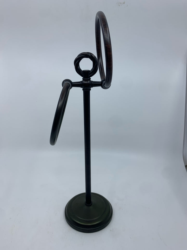 BROWN METAL TOWEL HOLDER.