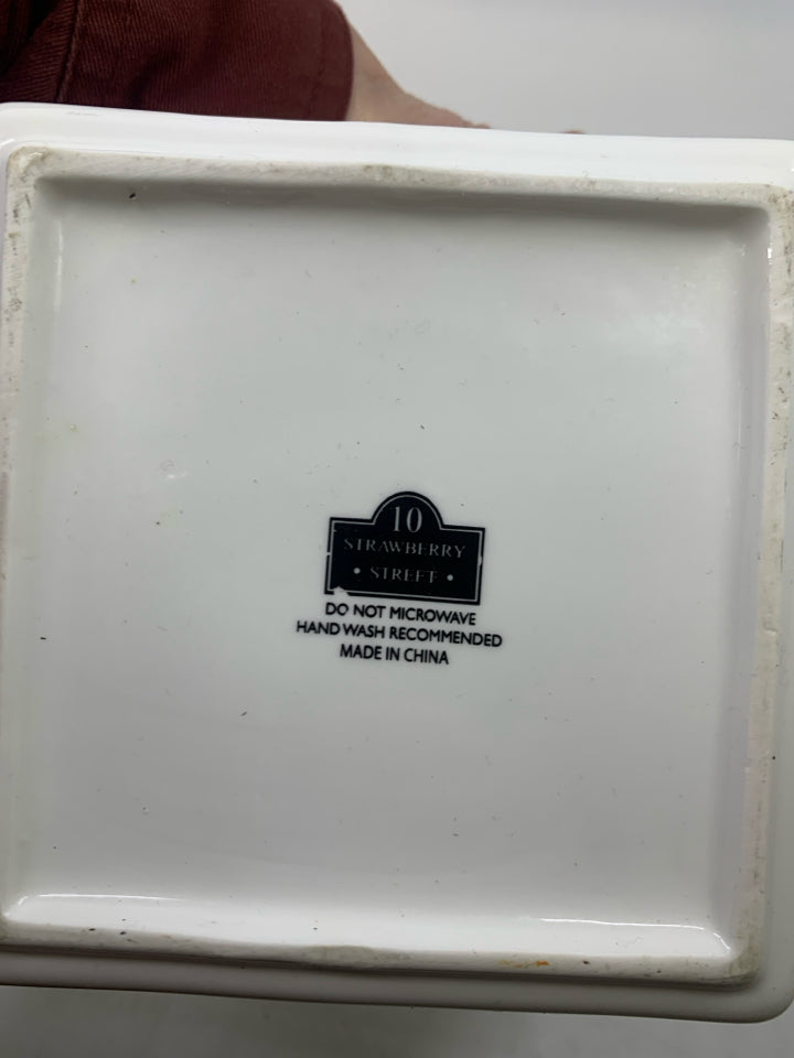 WHITE SQUARE BOWL W/ SILVER INSIDE RUFFLED EDGE HANDLES.