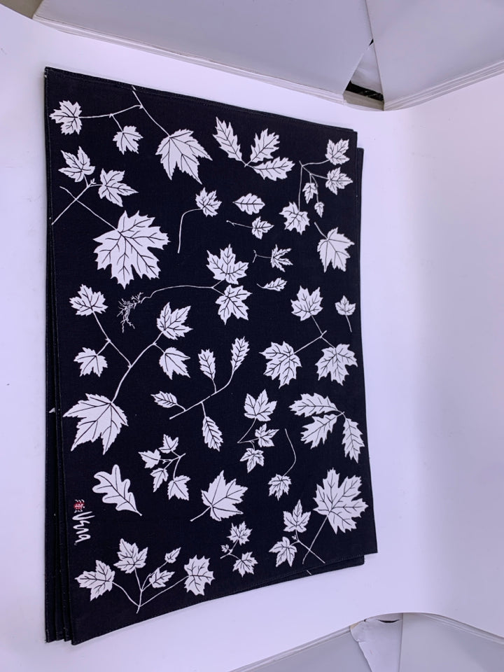 4 BLACK W/ WHITE LEAVES PLACEMATS.