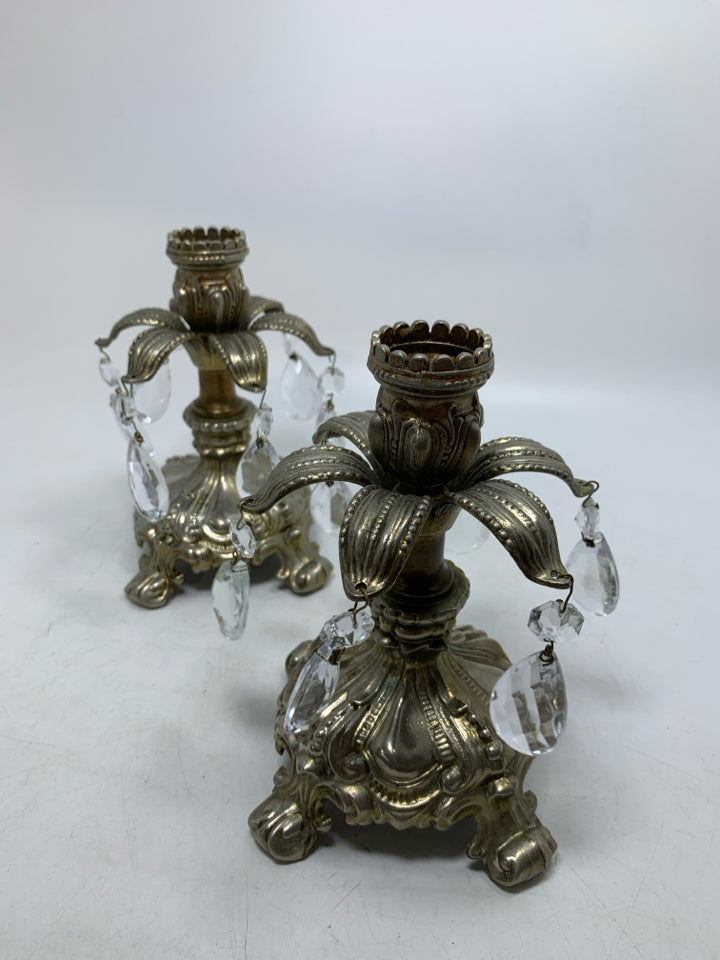 2 METAL ORNATE TAPERED CANDLE HOLDERS W/ HANGING FAUX CRYSTALS.
