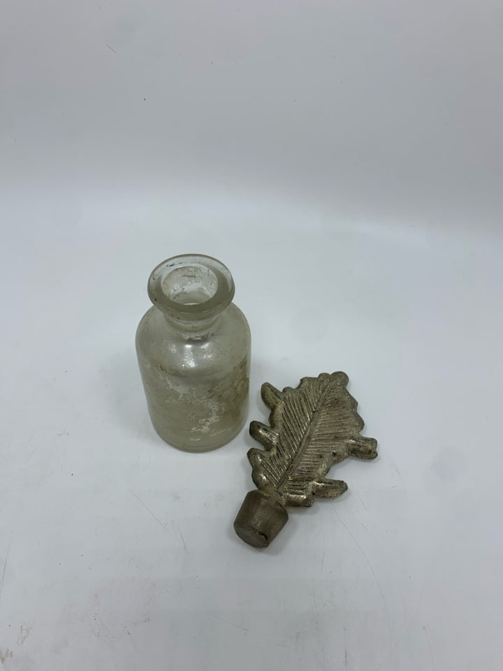 ART DECO GLASS BOTTLE W/LEAF TOPPER.