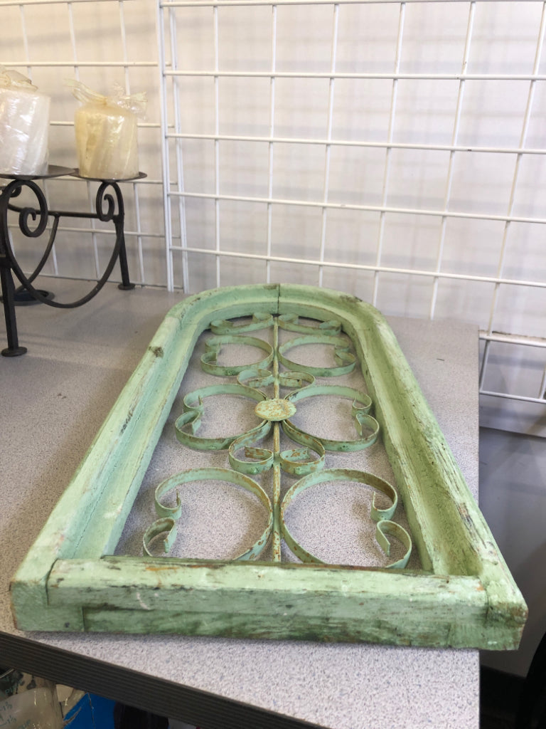DISTRESSED GREEN PAINTED ARCH W/ METAL SCROLL WALL ART.