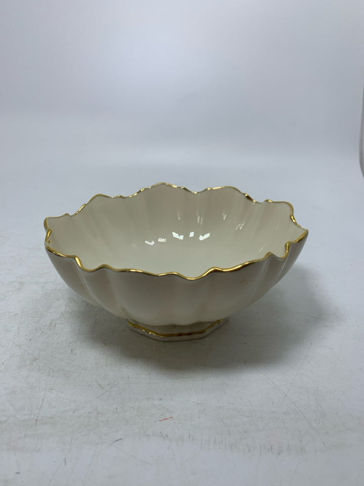 FOOTED CANDY DISH W/ UNEVEN GOLD EDGE.