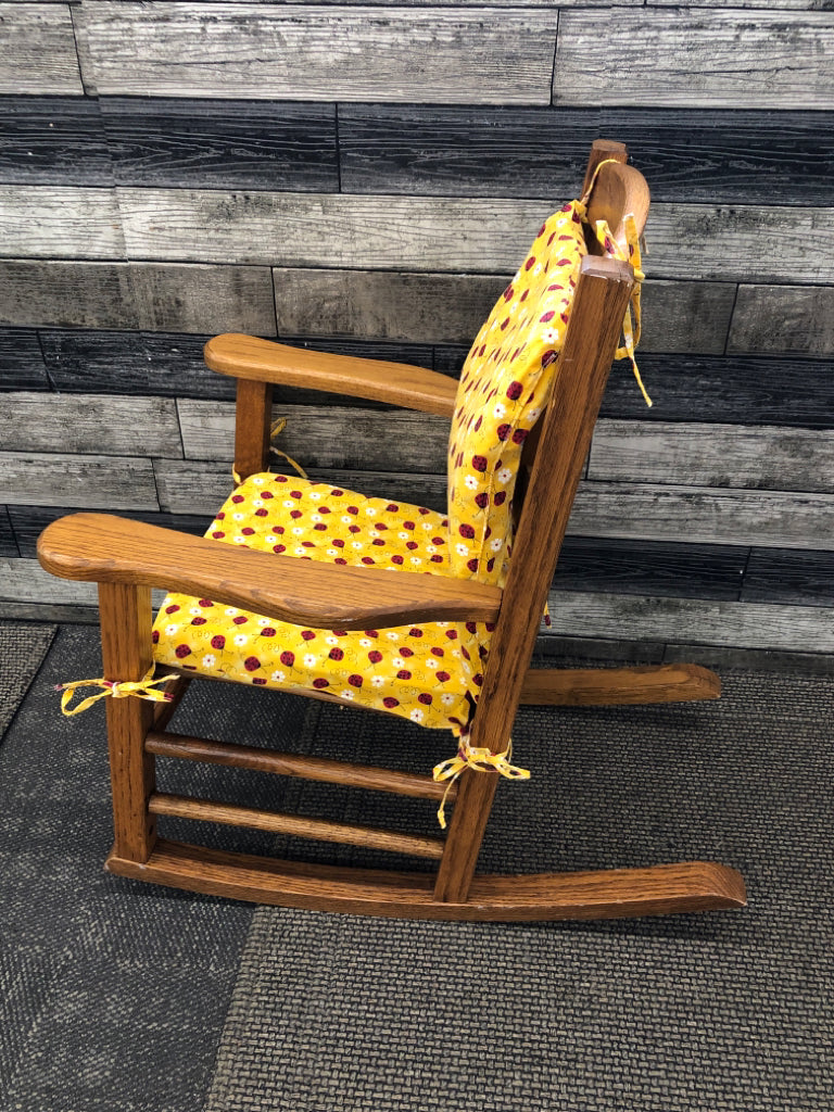 VTG KIDS WOOD ROCKING CHAIR W/LADYBUG CUSHIONS.