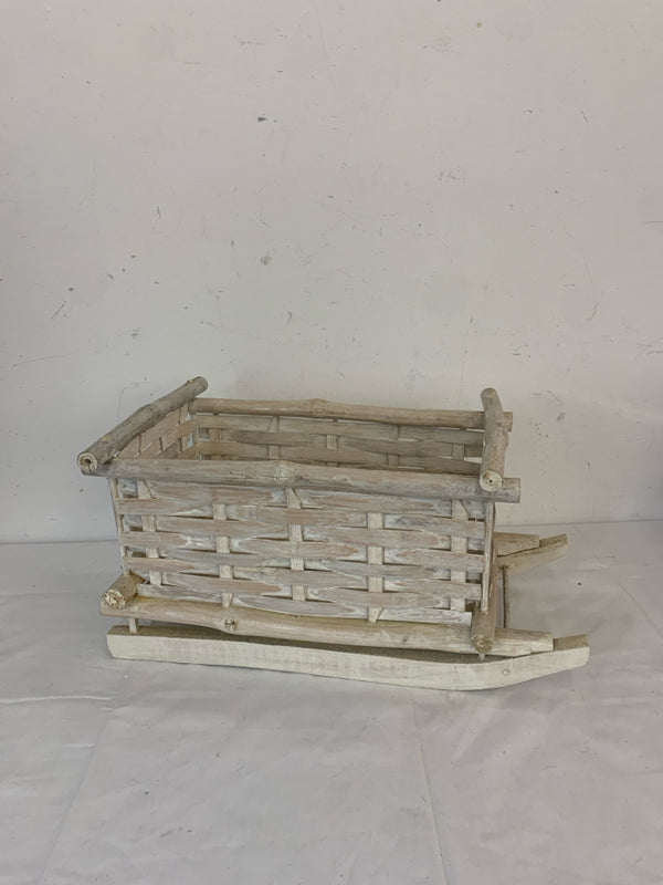 WHITE DISTRESSED WOOD SLED DECOR.