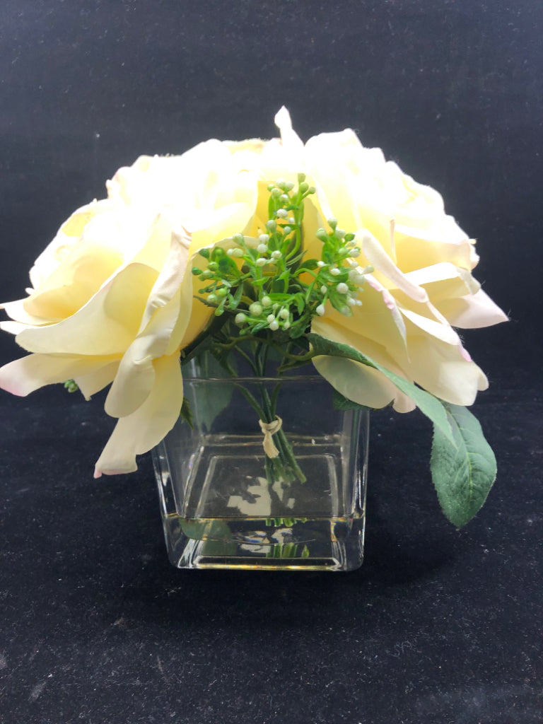 3 LARGE FAUX WHITE ROSES IN CLEAR SQUARE GLASS VASE.