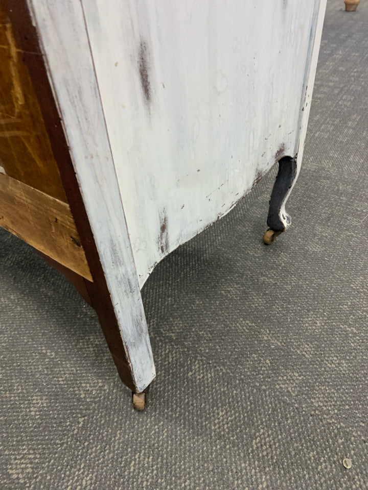 DISTRESSED DRESSER ON WHEELS.