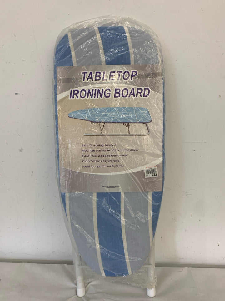 NIP IRONING BOARD.